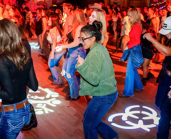 Line dancing on the dance floor at Stoney's Rockin' Country Las Vegas
